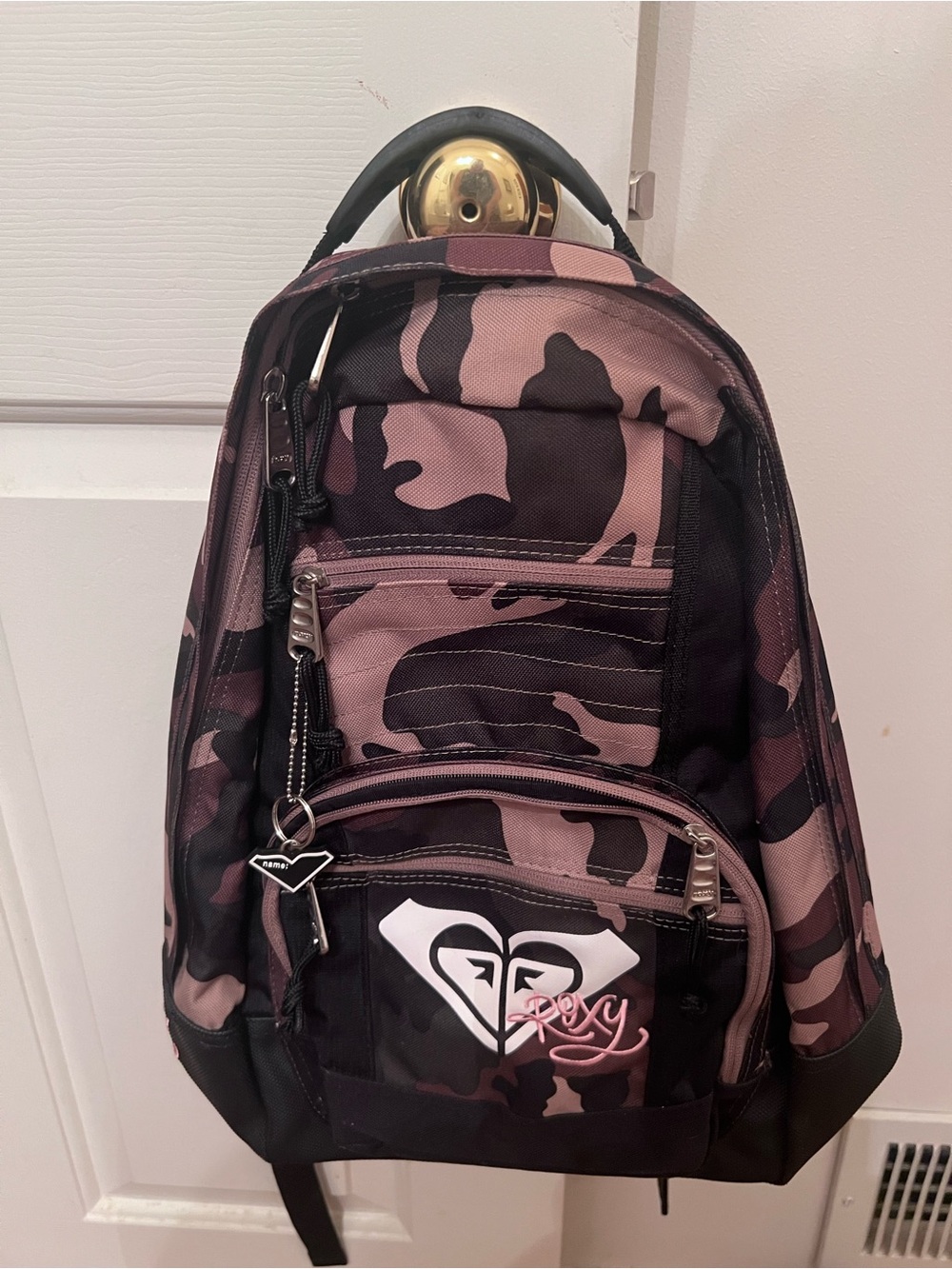 Roxy backpack with pink and black camouflage pattern.